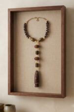 Filimbi necklace home framed Shikhazuri